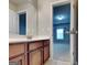 Bathroom featuring a vanity with a light countertop and a glimpse into an adjacent room at 330 Bentleigh Station Dr, Acworth, GA 30101