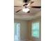 Bedroom features trey ceilings, a modern fan fixture and lots of natural light at 330 Bentleigh Station Dr, Acworth, GA 30101
