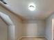 The carpeted bedroom features neutral walls and a contemporary ceiling light at 330 Bentleigh Station Dr, Acworth, GA 30101