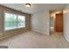 Bedroom with neutral carpet, natural light, and a hallway leading to another room at 330 Bentleigh Station Dr, Acworth, GA 30101