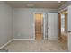 This bedroom features neutral carpet and paint, and an entrance to a walk-in closet at 330 Bentleigh Station Dr, Acworth, GA 30101