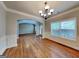 Dining room features hardwood floors, decorative molding, and chandelier at 330 Bentleigh Station Dr, Acworth, GA 30101