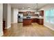 Stylish kitchen with island open to living area featuring modern appliances and cabinetry at 330 Bentleigh Station Dr, Acworth, GA 30101