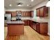 Modern kitchen features stainless steel appliances, a central island, and ample cabinet space at 330 Bentleigh Station Dr, Acworth, GA 30101