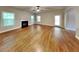 Bright living room featuring hardwood floors, fireplace, and access to outdoor space at 330 Bentleigh Station Dr, Acworth, GA 30101