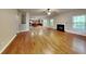 Open living area with hardwood floors, a fireplace, and seamless flow to kitchen at 330 Bentleigh Station Dr, Acworth, GA 30101