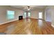 Open living room features hardwood floors, fireplace, and lots of natural light at 330 Bentleigh Station Dr, Acworth, GA 30101
