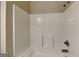 This bathroom features a functional white tub and shower with updated fixtures at 330 Bentleigh Station Dr, Acworth, GA 30101