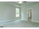 A cozy bedroom with large window, ceiling fan, tray ceiling and access to en-suite bathroom at 214 Wet Wood Ct # 26, Fairburn, GA 30213