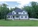 Traditional two-story home with a stone accent and a well-maintained lawn at 214 Wet Wood Ct # 26, Fairburn, GA 30213