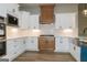 Well-appointed kitchen featuring white cabinets, stainless steel appliances, and hardwood floors at 214 Wet Wood Ct # 26, Fairburn, GA 30213
