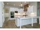 Bright kitchen with stainless steel appliances, a large island, and pendant lighting at 214 Wet Wood Ct # 26, Fairburn, GA 30213