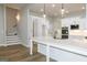 Modern kitchen with an oversized island, stainless appliances, and designer lighting at 214 Wet Wood Ct # 26, Fairburn, GA 30213
