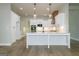 Modern kitchen featuring white cabinetry, stainless steel appliances, and large island at 214 Wet Wood Ct # 26, Fairburn, GA 30213