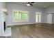 Spacious living room featuring wood floors, fireplace and back porch access at 214 Wet Wood Ct # 26, Fairburn, GA 30213