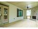 Beautiful outdoor porch with stone fireplace, wood ceiling, and glass doors leading outside to a deck at 214 Wet Wood Ct # 26, Fairburn, GA 30213