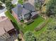 Aerial view of home featuring an outdoor living space, well-maintained lawn and screened in porch at 2390 Colchester Ct, Cumming, GA 30041