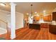 Spacious kitchen features an island, wood floors, stainless steel appliances and wooden cabinets at 2390 Colchester Ct, Cumming, GA 30041