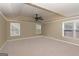Spacious main bedroom features a tray ceiling, ceiling fan, and carpet flooring for ultimate relaxation at 2390 Colchester Ct, Cumming, GA 30041