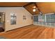 Enclosed sunroom featuring wood floors and paneled walls, providing a tranquil space for relaxation and enjoyment at 2390 Colchester Ct, Cumming, GA 30041
