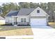 Charming single-story home featuring a mix of siding and brick accents and an attached two-car garage at 3423 Arabian Farm Ln, Dacula, GA 30019
