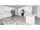 Modern kitchen with stainless steel appliances, white cabinetry, and granite countertops, complemented by stylish flooring at 3423 Arabian Farm Ln, Dacula, GA 30019