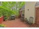 Exterior of home showcasing the wood deck with outdoor seating and the backyard at 30 Joe Lee Dr, Sharpsburg, GA 30277