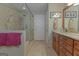 Tiled bathroom features a large shower, vanity with granite countertop, and ample storage at 30 Joe Lee Dr, Sharpsburg, GA 30277