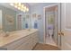 Bathroom with a double sink vanity, blue walls, and a separate toilet room at 30 Joe Lee Dr, Sharpsburg, GA 30277