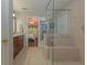 Bright bathroom view showcasing tiled floors, granite vanity, and frameless glass shower at 30 Joe Lee Dr, Sharpsburg, GA 30277