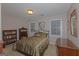 Comfortable bedroom with carpeted floors, two windows, and matching dressers and bookshelves at 30 Joe Lee Dr, Sharpsburg, GA 30277