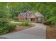 Lovely home with a winding driveway, well-maintained landscaping, and inviting front entrance at 30 Joe Lee Dr, Sharpsburg, GA 30277