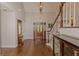 Grand foyer with hardwood floors, staircase, and elegant details at 30 Joe Lee Dr, Sharpsburg, GA 30277