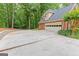 Spacious driveway and brick garage with ample parking space at 30 Joe Lee Dr, Sharpsburg, GA 30277