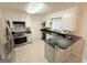 Updated kitchen boasts granite countertops and stainless steel appliances at 30 Joe Lee Dr, Sharpsburg, GA 30277