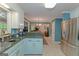 Kitchen with stainless appliances, view to breakfast nook, and decorative backsplash at 30 Joe Lee Dr, Sharpsburg, GA 30277