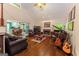 Bright living room with vaulted ceilings, hardwood floors, fireplace, and open floor plan at 30 Joe Lee Dr, Sharpsburg, GA 30277