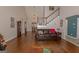 Spacious living room with high ceilings, hardwood floors, and staircase with white railings at 30 Joe Lee Dr, Sharpsburg, GA 30277