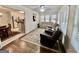 Inviting living room features hardwood floors, plush seating, and a view into the modern kitchen at 30 Joe Lee Dr, Sharpsburg, GA 30277