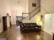 Elegant living room with high ceilings, hardwood floors, and staircase at 30 Joe Lee Dr, Sharpsburg, GA 30277