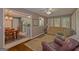 Inviting living room open to the kitchen, showcasing wood floors, neutral paint, and natural light at 30 Joe Lee Dr, Sharpsburg, GA 30277