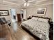 Spacious main bedroom with hardwood floors, tray ceiling, and large windows for abundant natural light at 30 Joe Lee Dr, Sharpsburg, GA 30277