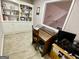Home office with custom built-in shelving, desk, and plenty of storage solutions at 30 Joe Lee Dr, Sharpsburg, GA 30277
