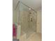 Spacious glass-enclosed shower with dual shower heads and built-in shelves enhances the bathroom at 30 Joe Lee Dr, Sharpsburg, GA 30277