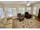 Bright sunroom filled with natural light and hardwood floors and view of nature at 30 Joe Lee Dr, Sharpsburg, GA 30277