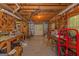 Interior view of a workshop with exposed beams, workbenches, and an array of tools at 30 Joe Lee Dr, Sharpsburg, GA 30277