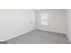 Bedroom featuring neutral carpet, a window with blinds, and a white door at 3402 Arabian Farm Ln, Dacula, GA 30019