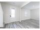 Bright living room featuring neutral walls, light-colored flooring, and a white door with frosted glass at 3402 Arabian Farm Ln, Dacula, GA 30019
