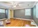 Spacious bedroom features hardwood floors, ceiling fan, closet, and good natural lighting at 2201 Valley Creek Cir, Snellville, GA 30078