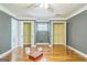 A gray bedroom with hardwood floors, two closets, and good natural lighting at 2201 Valley Creek Cir, Snellville, GA 30078
